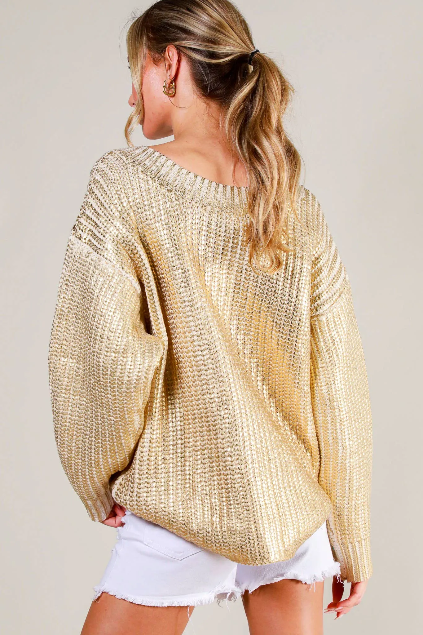 A Shining Statement Gold Metallic Sweater